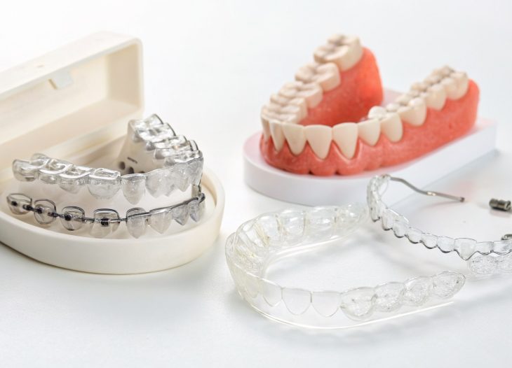 Editorial hero image illustrating Retainers vs Invisalign: Which Is Right for Straightening Your Teeth in London? for a Dentist brand.